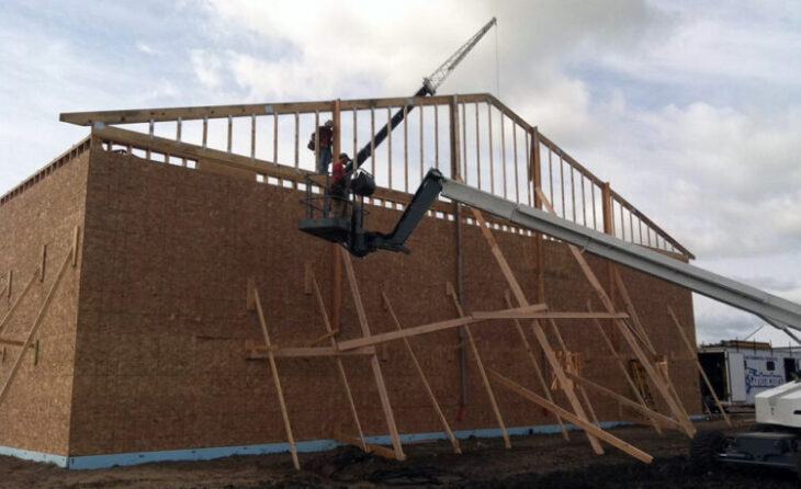 Modern Commercial Building Under Construction with Crane