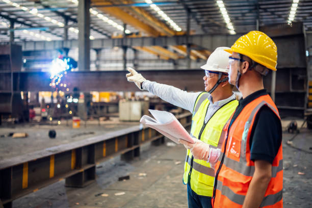 Engineers inspecting ongoing commercial steel construction site